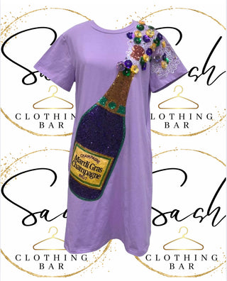 Purple t-shirt  dress with a sequin champagne bottle design 