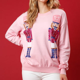 pink nutcracker sequin sweater