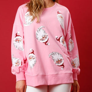 pink sweater with vintage sequin Santa patches